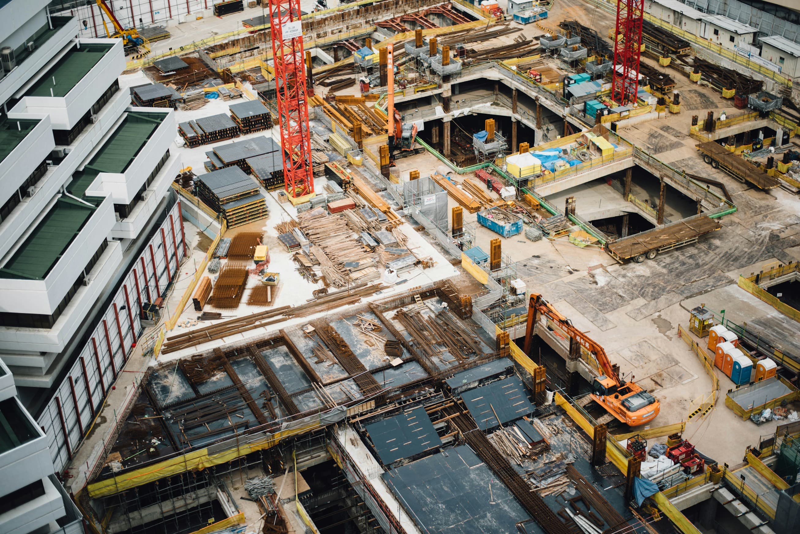 Aerial view of the site during construction, with access tracks cut across the ground.
